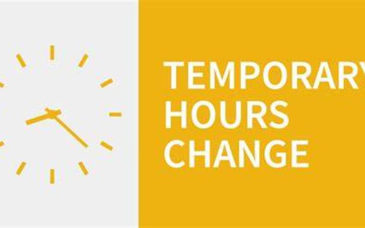 a white side with yellow clock - and a yellow box with the words Temporary Hours Change