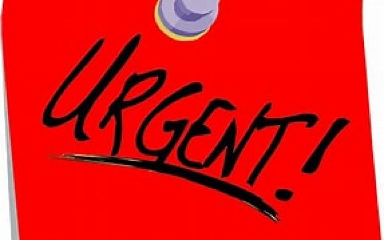 Red sticky note with word URGENT!